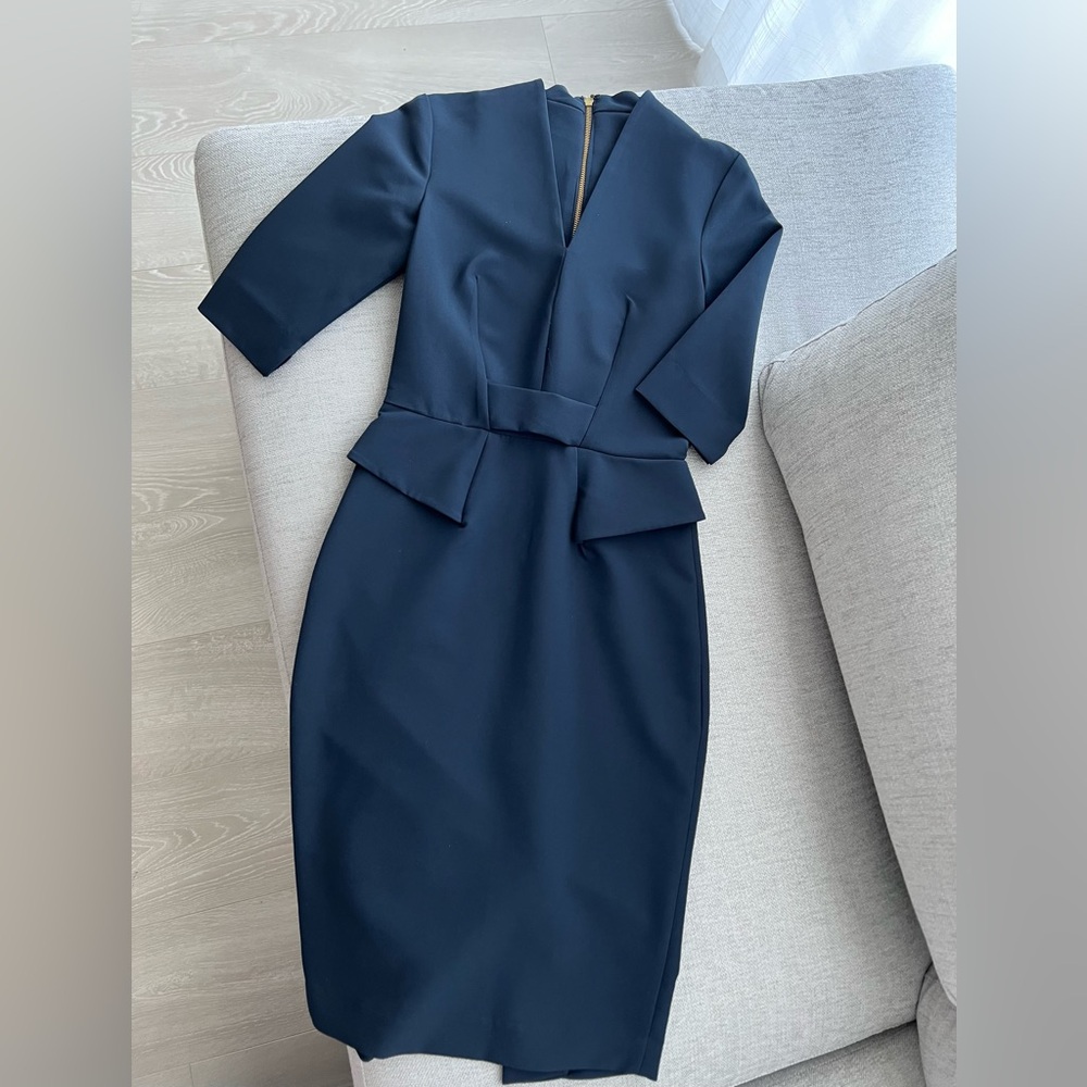 Elegant tailored business dress with a cinched waist